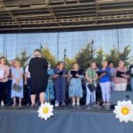 picture showing members of the Chord On Blues choir performing at the Festival of Ferns 2023