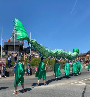 Picture showing a giant sea monster puppet marching in the Festival of Ferns 2023 parade